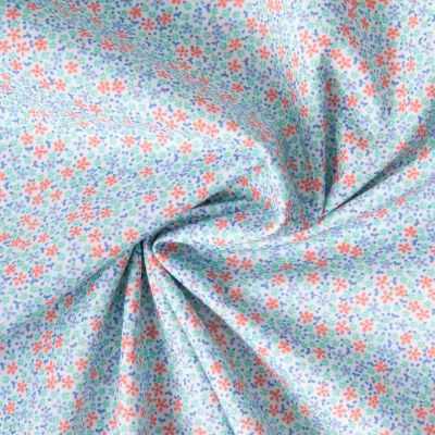 Tissu Batiste de Coton Nora tapis fleuri sur fond Bleu clair - Par 10 cm