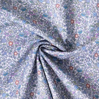 Tissu Batiste de Coton Charlie tapis fleuri sur fond Bleu lilas - Par 10 cm