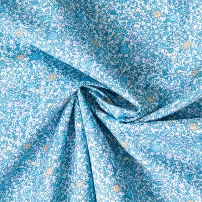 Tissu Batiste de Coton Charlie tapis fleuri sur fond Bleu ciel - Par 10 cm