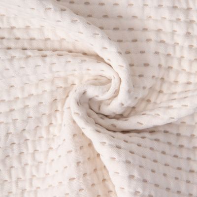Tissu Coton Jacquard piqué pointillés relief sur fond Naturel - Par 10 cm