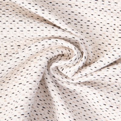 Tissu Jacquard Coton piqué pointillés Noir et Beige sur fond Ecru - Par 10 cm