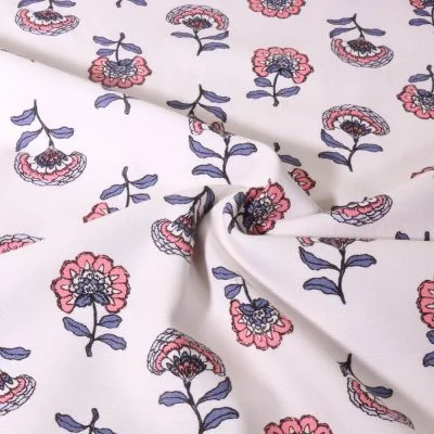 Tissu Toile de Coton Canvas Poppy Fleuris rose et parme sur fond Blanc - Par 10 cm