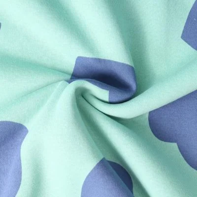 Tissu Jersey Coton coeurs Léane Bleus sur fond Vert menthe - Par 10 cm