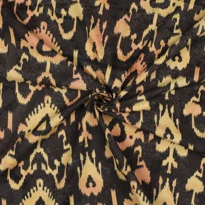 Tissu Batik de Coton motif ethnique Beige doré sur fond Noir profond - Par 10 cm
