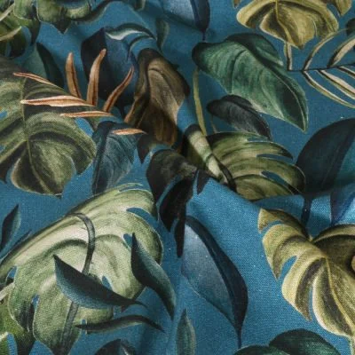 Tissu Toile de Coton Canvas Feuilles tropicales sur fond Bleu canard - Par 10 cm