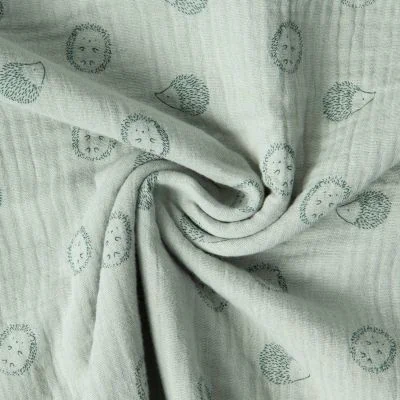 Tissu Double Gaze de Coton Poppy petits Hérissons sur fond Vert pastel - Par 10 cm