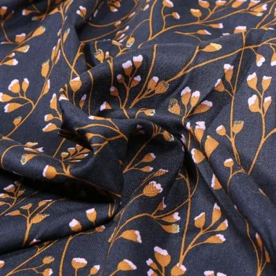 Tissu Viscose Branches pailletées sur fond Bleu marine - Par 10 cm