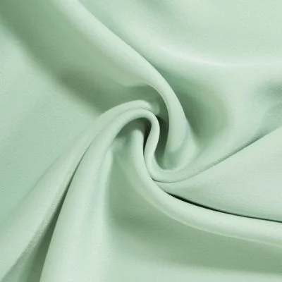 Tissu Crêpe Satin mat uni Vert amande - Par 10 cm