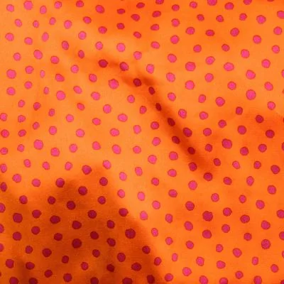 Tissu Crêpe Satin pois sur fond Orange - Par 10 cm