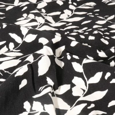 Tissu Viscose imprimé Feuillage blanc sur fond Noir - Par 10 cm