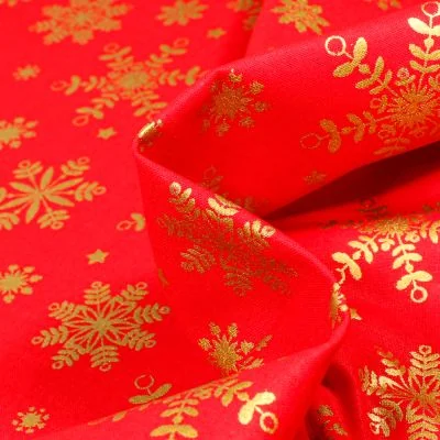Tissu Coton imprimé Bio Flocons dorés sur fond Rouge - Par 10 cm