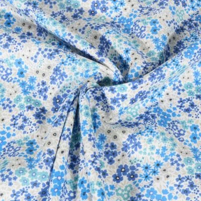 Tissu Voile de Coton digital Petites fleurs bleues sur fond Blanc - Par 10 cm