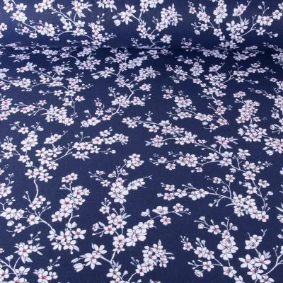 Tissu Coton imprimé Fleur d&#039;amandier sur fond Bleu marine - Par 10 cm