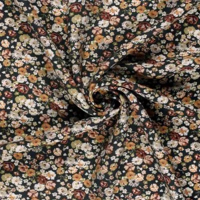 Tissu Crêpe de Viscose Bérengère fleurs Blanches sur fond Noir - Par 10 cm
