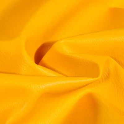Simili cuir d&#039;ameublement uni Jaune curcuma - Par 50 cm